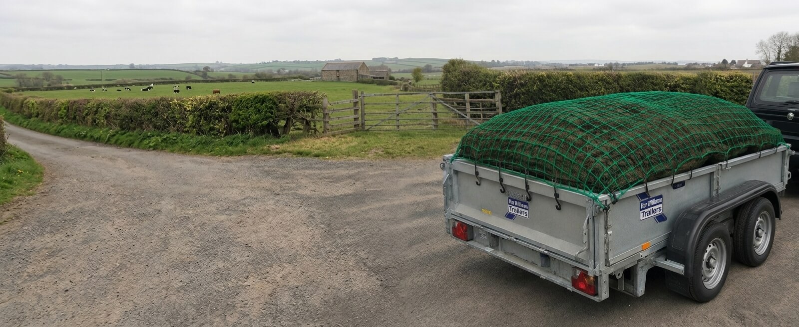 Cargo net secured over a loaded trailer