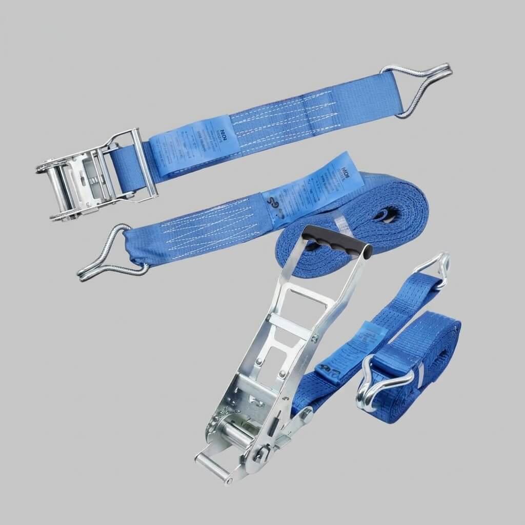 Ratchet straps securing a load on a flatbed trailer behind a tractor