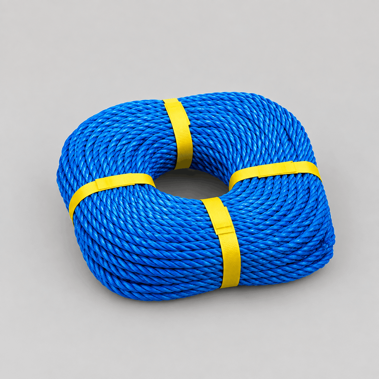 Coiled blue TITAN 14mm poly rope on a white background